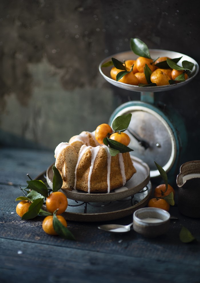 Bundt cake with mandarins on a vintage scale