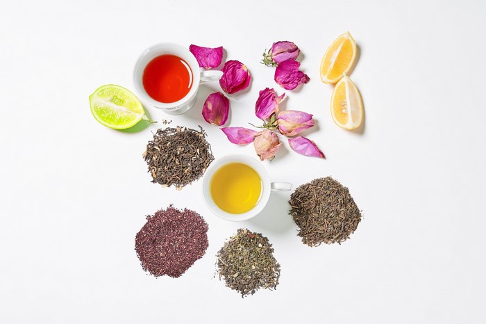Tea, Roses, Lemons, and Lime on White Background