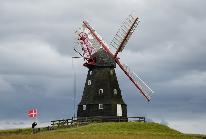 Windmill on a hill with Danish flag