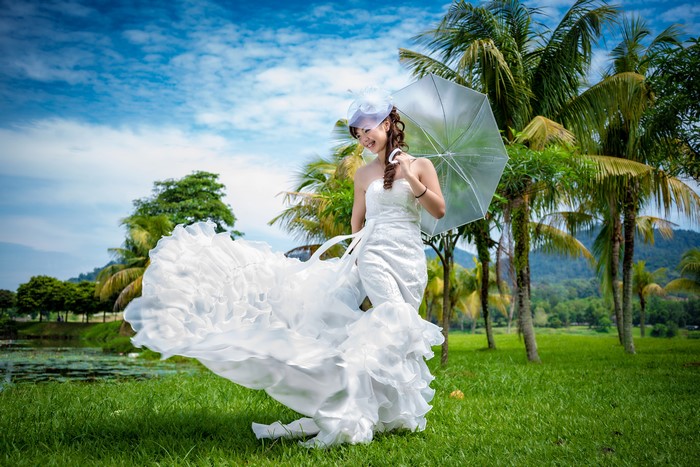 Bride with Umbrella and Palms