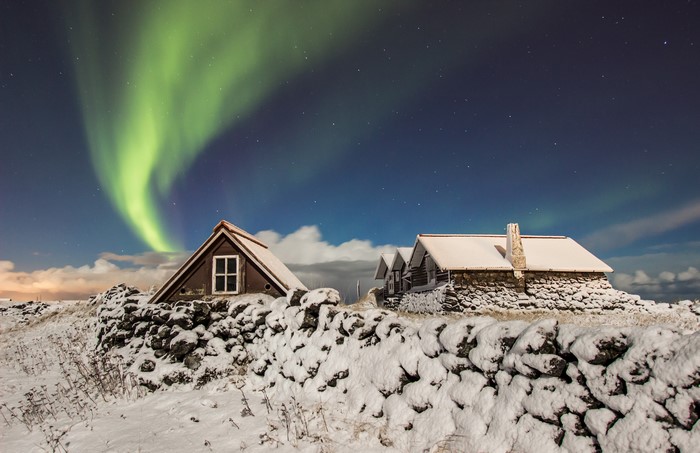 Aurora Borealis over Icelandic Houses in Winter