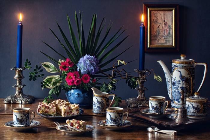 Still-life with candles, flowers, and tea set