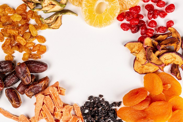 Assortment of dried fruits on a white background