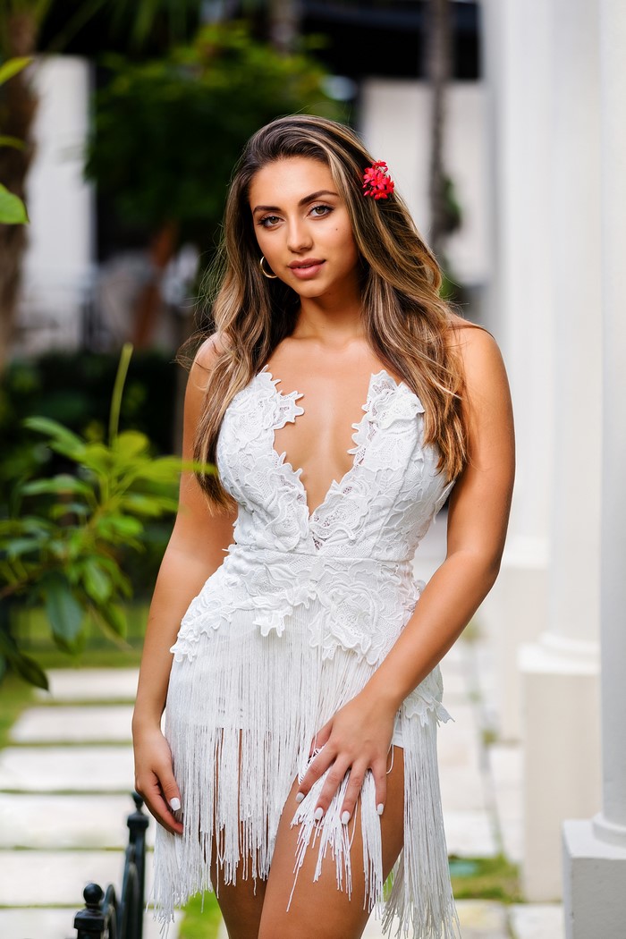 Woman in white lace dress with fringe