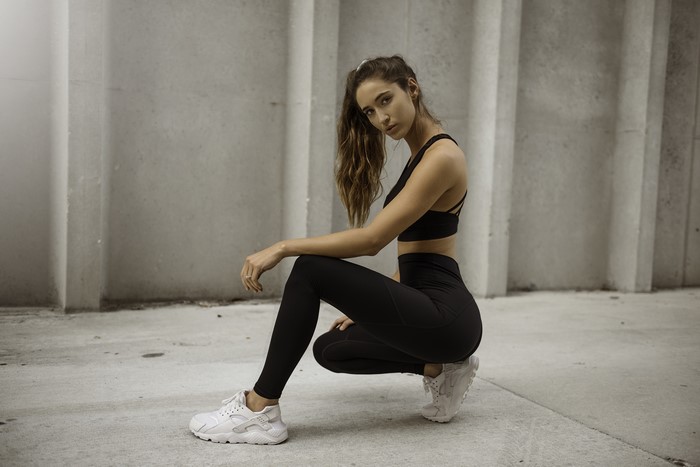 4K Fitness Woman Sitting in Athletic Wear