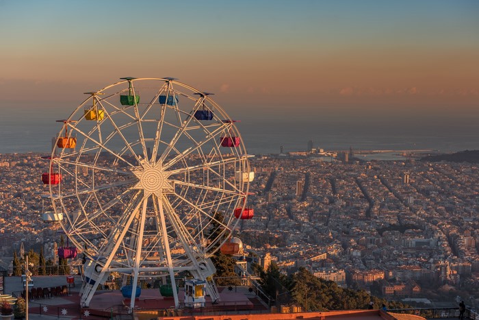 Ferris wheel overlooking Barcelona at sunset