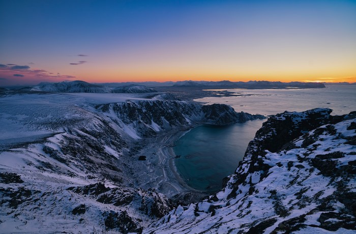 Snowy Lofoten Coastline and Mountains at Dusk