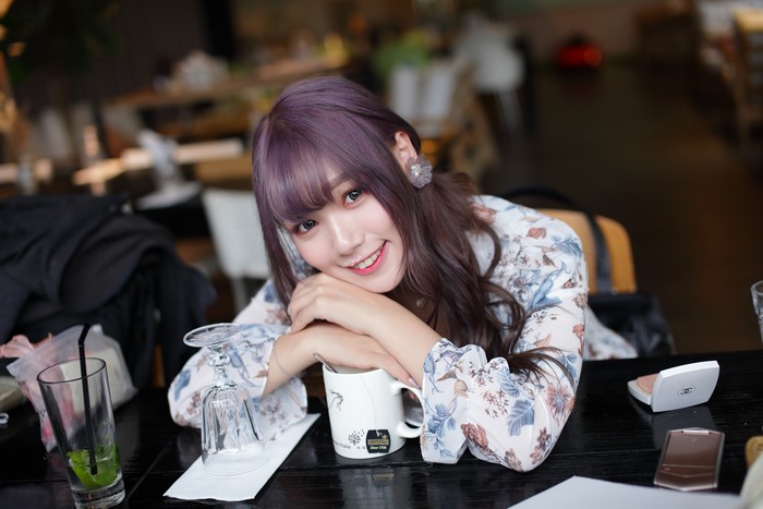 Asian girl with purple hair smiling