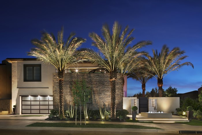 Modern Mansion with Palm Trees at Night in Irvine, California