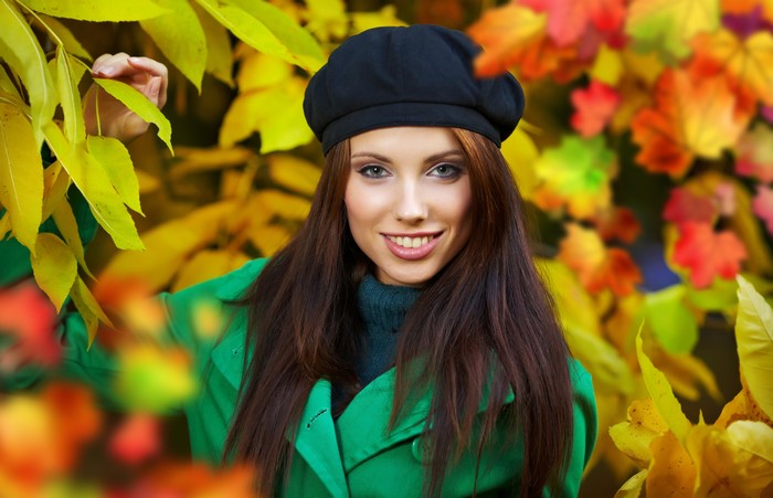 Woman in Beret and Green Coat in Autumn