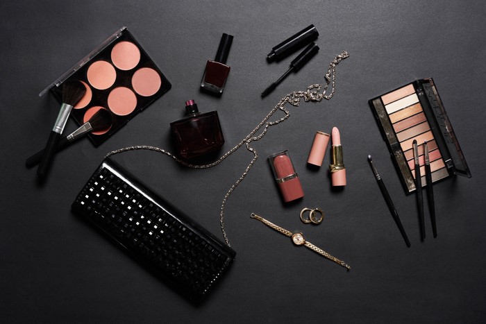 Cosmetics and accessories on a gray background