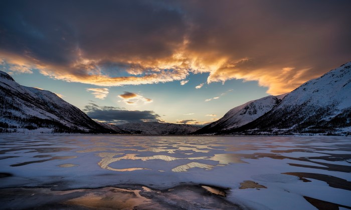 Frozen fjord in Finnmark, Norway at sunset