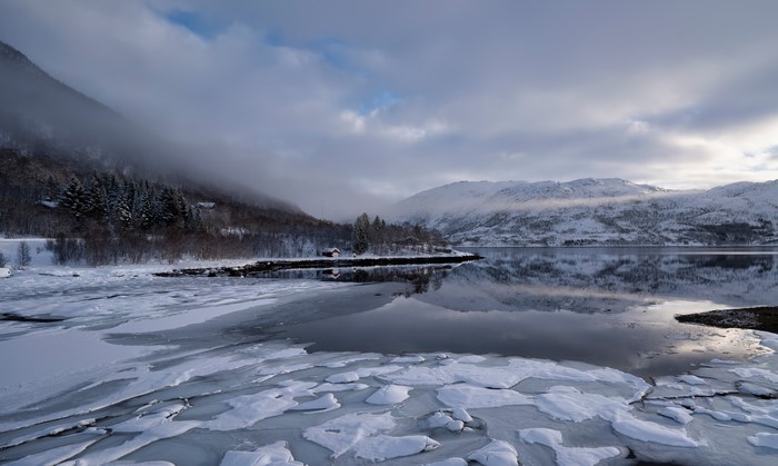 Winter landscape with mountains and ice in Norway