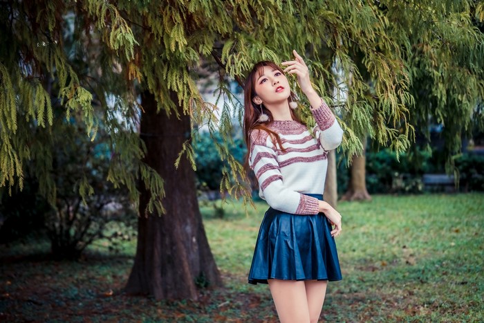 4K Asian Woman Posing Under Tree Branches