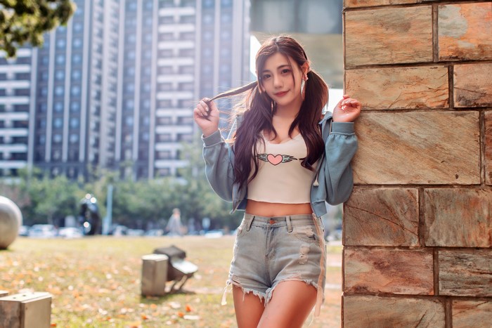 Asian girl in shorts and jacket