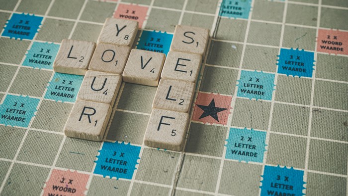 Scrabble board with words LOVE YOUR SELF
