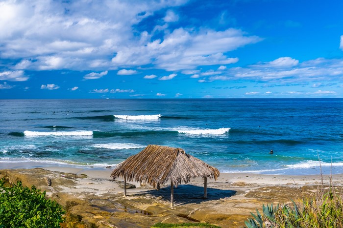 Thatched Hut on a Rocky Beach in California