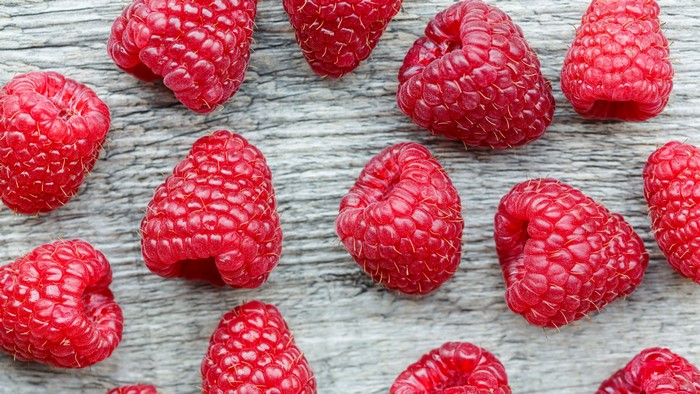 Raspberries on a wooden surface