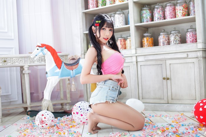 Brunette girl in shorts posing