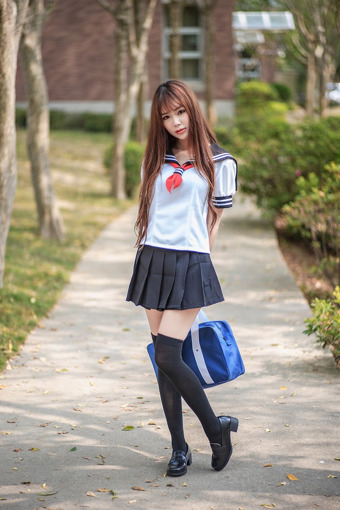 Asian Schoolgirl in Navy Uniform Pose