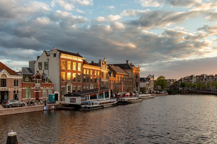 Spaarne river in Haarlem, Netherlands with riverboats