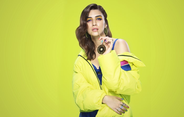 Kriti Sanon in Yellow Jacket with Colored Background