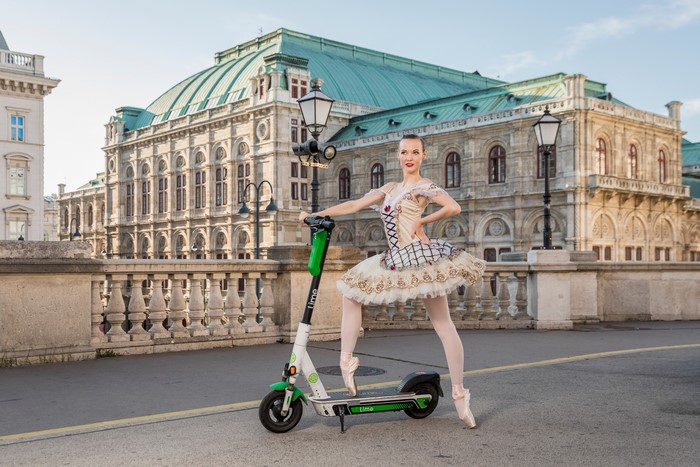 Anastasia with Kick scooter in front of Vienna State Opera