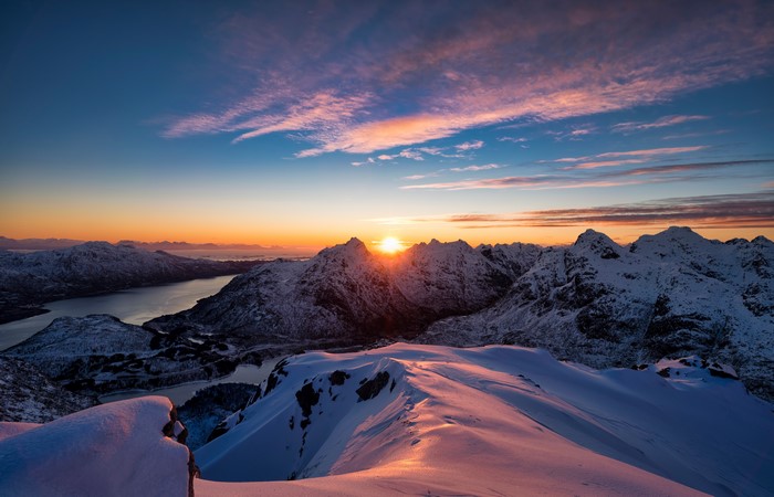 Snowy mountains and fjord at sunrise in Lofoten, Norway