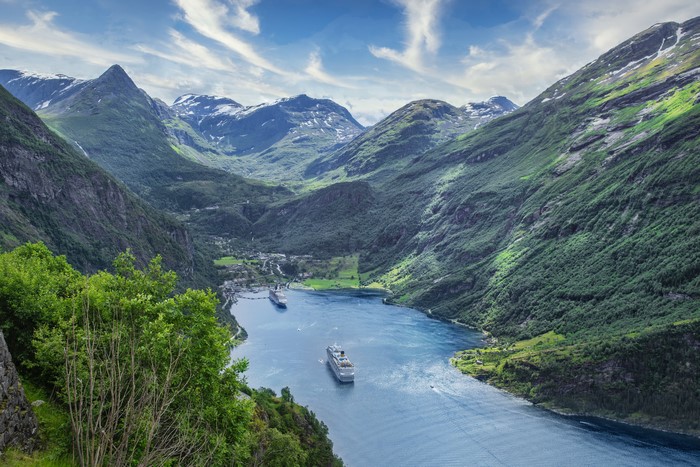 Cruise liners in a Norwegian fjord with mountains