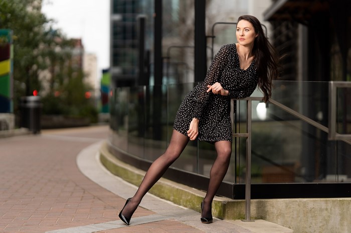 Natalia Larioshina in a polka dot dress posing outdoors