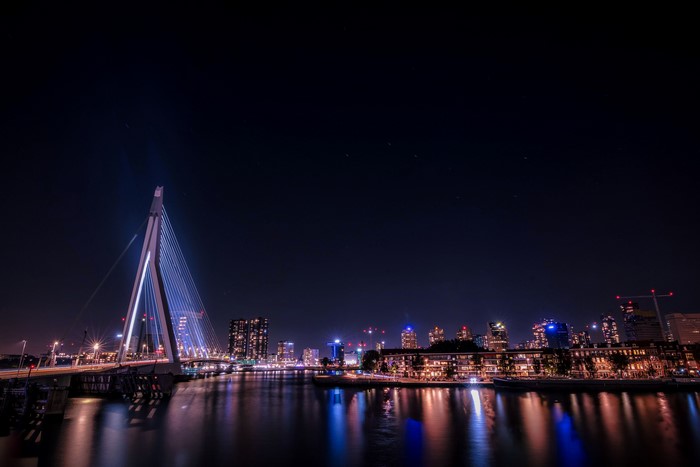Erasmus Bridge over river at night in Rotterdam
