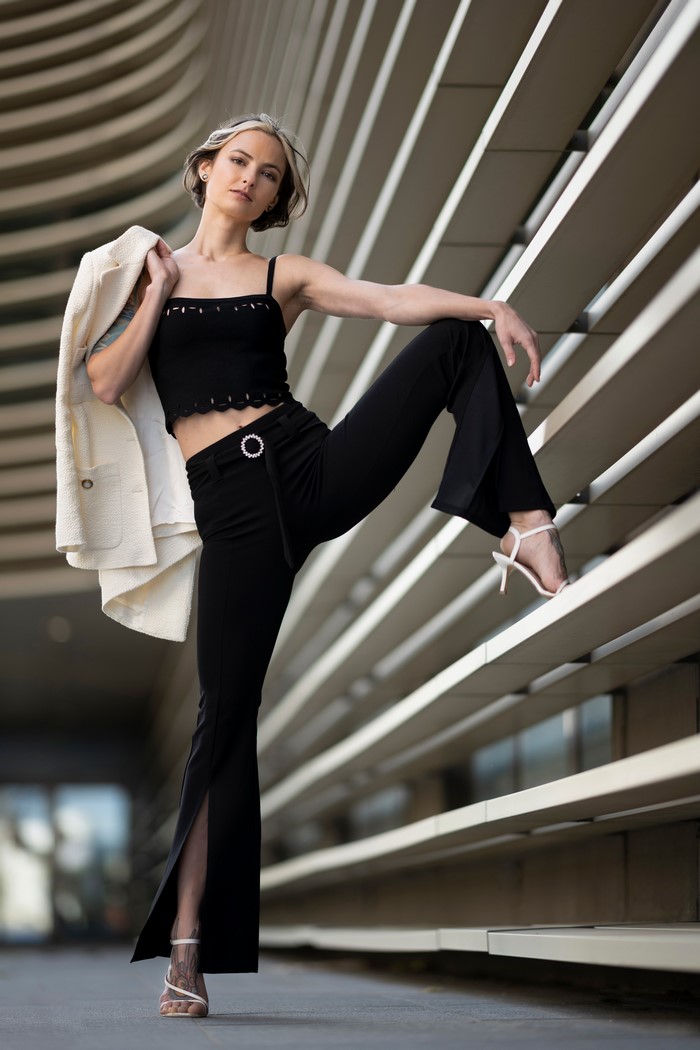 Alena Striking Pose in Black Trousers and Singlet