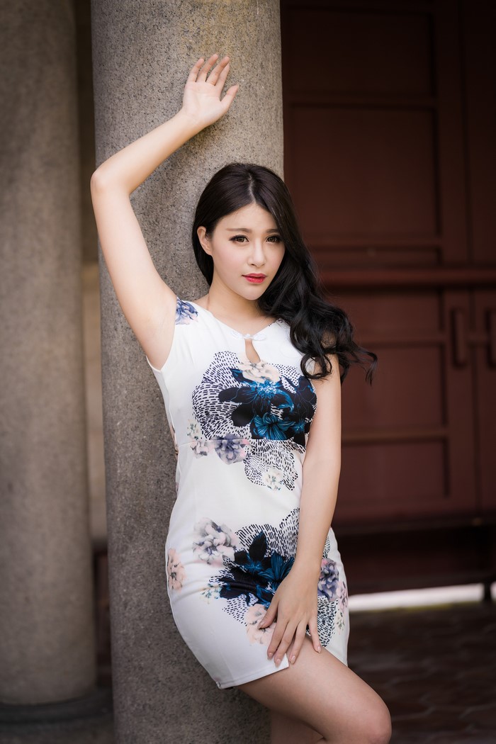 Asian Woman in Floral Dress Posing Elegantly