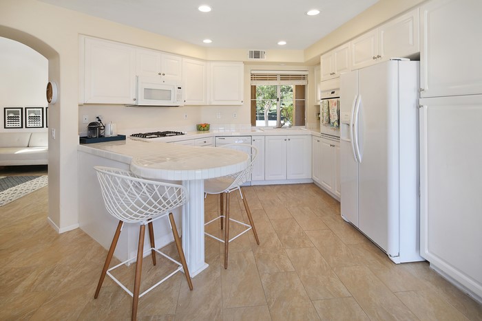 Kitchen with white cabinets and island