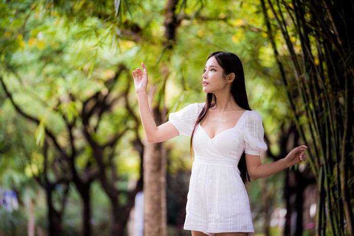 4K Elegant Asian Woman Posing in White Dress