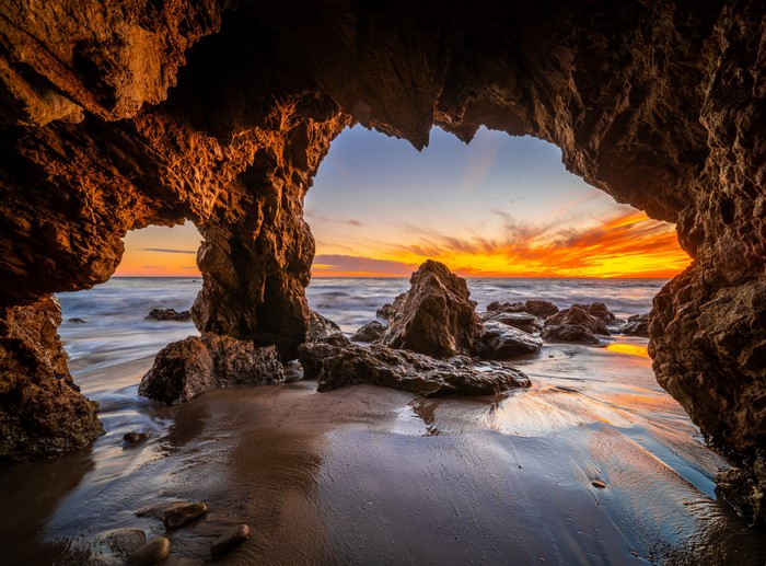 Cave entrance at El Matador Beach, California at sunset