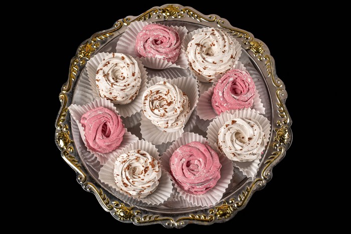 Little cakes on a silver platter