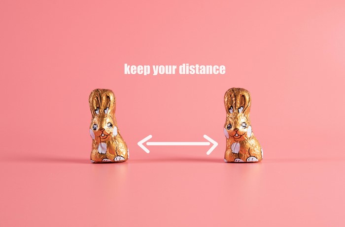 Chocolate Easter bunnies with social distancing message
