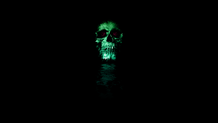 Green skull with red eyes and reflection
