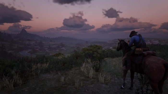 Man on horse in Red Dead Redemption 2 landscape