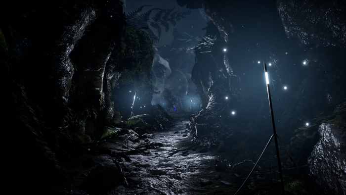 Video game cave with glowing lights and plants