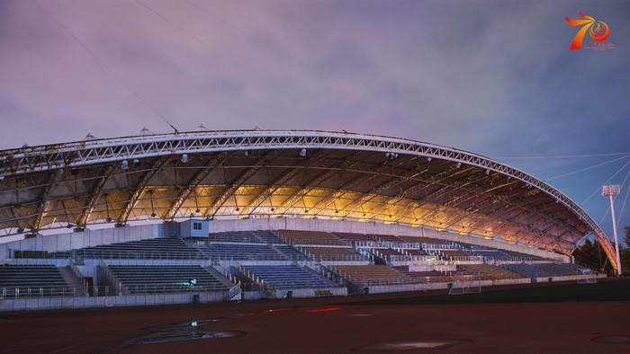 Stadium with illuminated roof and seating