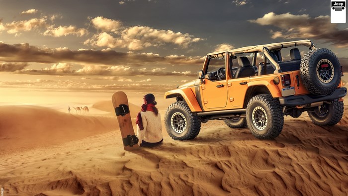 Jeep Wrangler in the desert with a person and camels