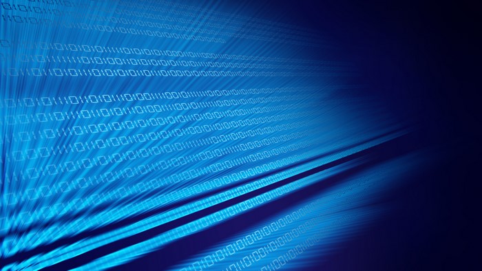 Binary code flowing on blue background