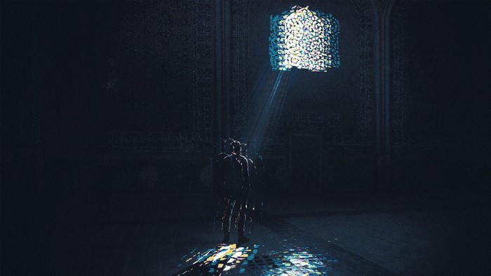 Man in dark room with stained glass window