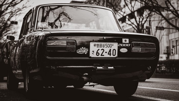 Black vintage car with Japanese license plate