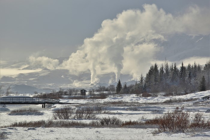 Geothermal area with steam rising in Iceland