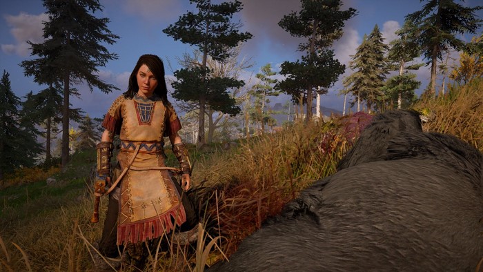 Female character from Assassin's Creed: Valhalla in a forest