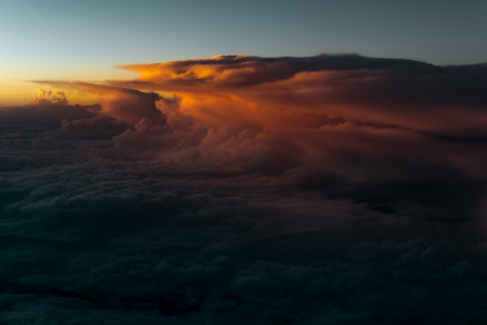 Sunset clouds over a sea of clouds