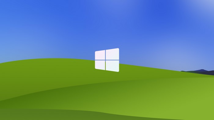 Windows logo on green hills and blue sky